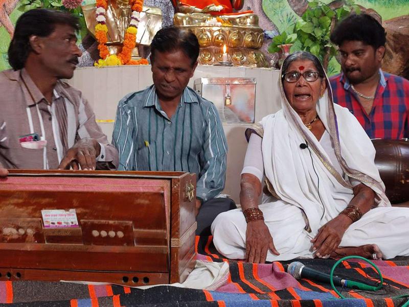 Elderly woman sings anti-caste songs with three musicians